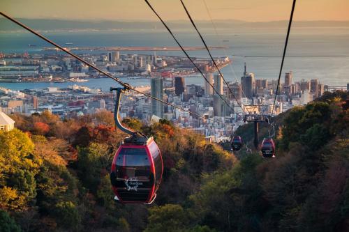 a group of gondolas flying over a city at ANA Crowne Plaza Kobe by IHG in Kobe