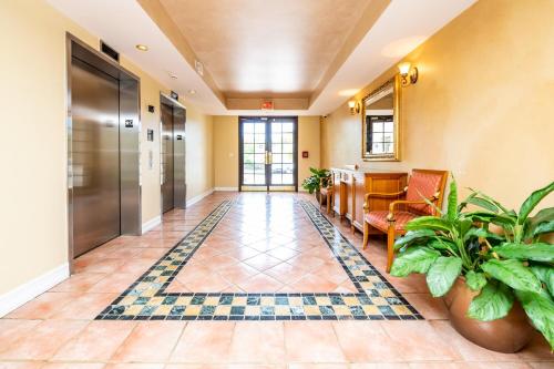 an office lobby with a hallway with plants at Luxury 3 Bds in Aventura Yacht club in Aventura