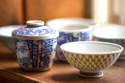 a group of blue and white bowls on a table at Private Tavern, Hot Tub, 8-Fireplaces, Spa Baths, Fire Pit, Baths Ensuite - Shop or Ski! in Landgrove Town Center