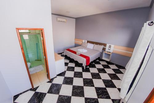 Ένα ή περισσότερα κρεβάτια σε δωμάτιο στο Hotel Rolim