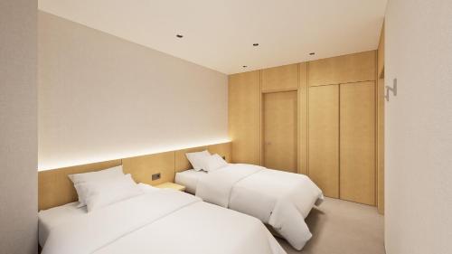 Una cama o camas en una habitación de Lotte Hotels & Resorts Gimhae