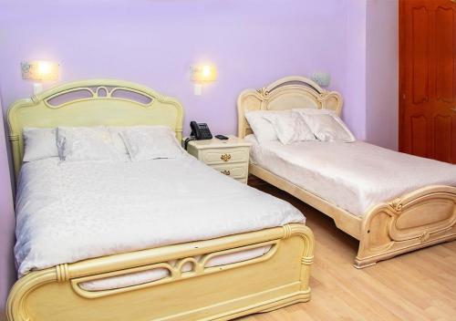 Ein Bett oder Betten in einem Zimmer der Unterkunft Hotel Boutique Casa Ruth en Cuenca