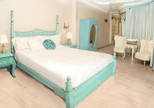 Ein Bett oder Betten in einem Zimmer der Unterkunft Hotel Boutique Casa Ruth en Cuenca