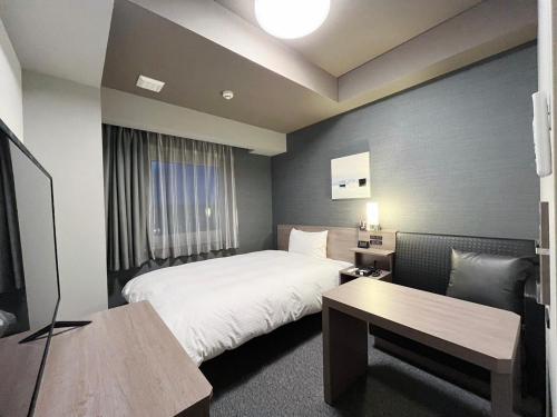 Postel nebo postele na pokoji v ubytování Hotel Route Inn Rifu