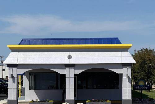 a building with a roof with solar panels on it at Days Inn by Wyndham Salina South in Salina