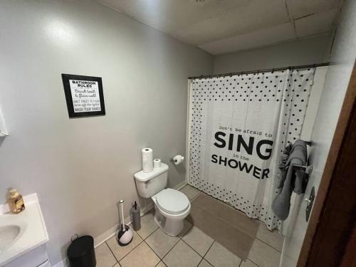 a bathroom with a white toilet and a sink at Spacious 3BR-3BA, Downtown Morgantown, Near WVU in Morgantown