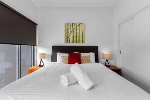 Ένα ή περισσότερα κρεβάτια σε δωμάτιο στο Beach and Reef Townhouse