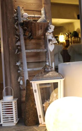 a shelf with a basket on top of a table at Cà Virò in Albosaggia