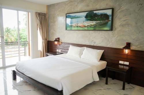 Postel nebo postele na pokoji v ubytování Khaolak Suthawan Resort - SHA Plus