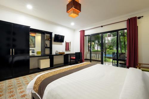 Ένα ή περισσότερα κρεβάτια σε δωμάτιο στο La Residence WatBo Hotel
