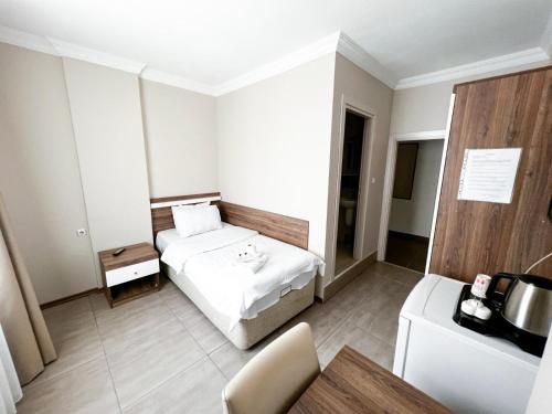 En eller flere senge i et værelse på Beyazhan Otel