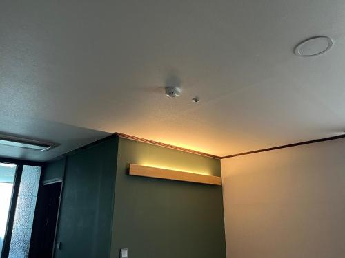 a room with a ceiling with a light on it at Sacheon Grand Tourist Hotel in Sacheon
