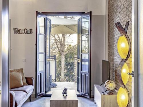 a living room with a couch and a table at Terraza de Triana in Seville