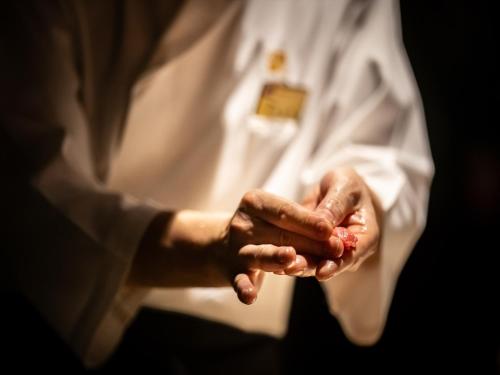 a person holding their hands up in the air at Oriental Hills Okinawa in Onna