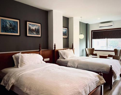 Point Boutique Hotel 객실 침대