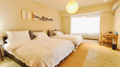 Ένα ή περισσότερα κρεβάτια σε δωμάτιο στο Cozy Li Riverside Inn