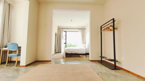 Ένα ή περισσότερα κρεβάτια σε δωμάτιο στο Cozy Li Riverside Inn