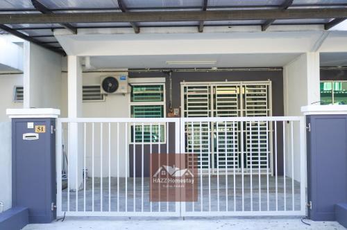 a gate in front of a house at HAZZ Homestay Puncak Ihsan in Kulim