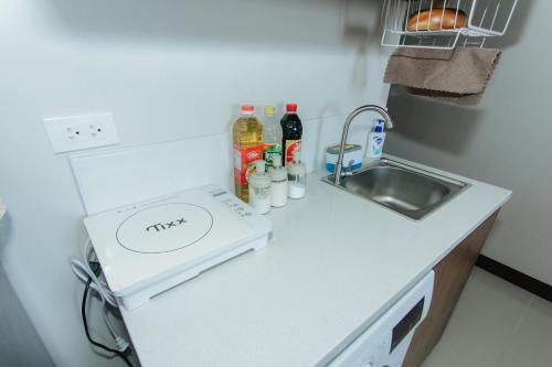 Nhà bếp/bếp nhỏ tại Saekyung Condo near Airport with Seaview & Tourist Spot