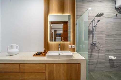 a bathroom with a sink and a shower at Special Offer! Elegant 2-Bedroom Villa with Large Pool in Canggu! in Canggu