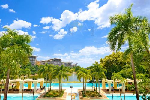 a view of the pool at the resort at PICO DE LORO Pool Accessible CAROLA 2 Bedroom Units by SEE Condominiums in Nasugbu