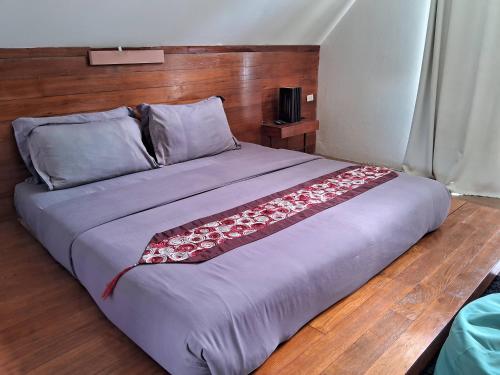 Postel nebo postele na pokoji v ubytování At Samui Haus