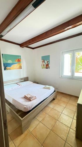 a bedroom with a bed in a room at Onda Marina Apartments in Forio d'Ischia