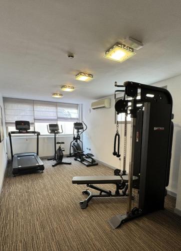 a gym with several exercise equipment in a room at Hotel Colon Rambla in Santa Cruz de Tenerife