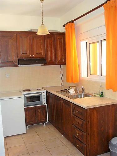 Kuchyň nebo kuchyňský kout v ubytování PHILIPPOS Hotel Apartments