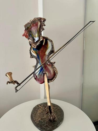 a metal art object on top of a table at Private bedrooms near Eiffel Tower in Paris