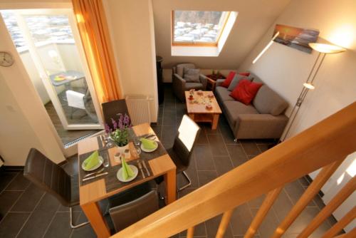 a living room with a couch and a table at Sonnenschein 29 - Großenbrode in Grossenbrode
