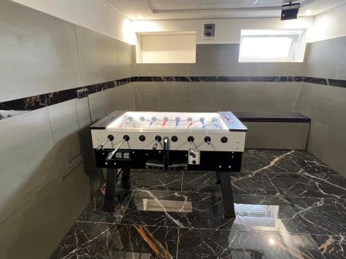 a bathroom with a machine in the corner of a room at Dream Home in Szentes