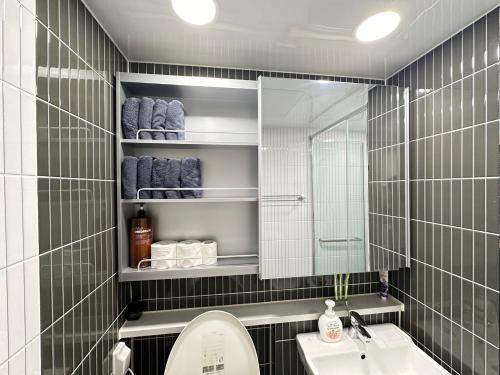 a bathroom with a sink and a mirror at Tempus urban stay hotel in Daegu
