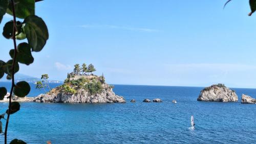 an island in the middle of the ocean at Sea Colours Parga in Parga