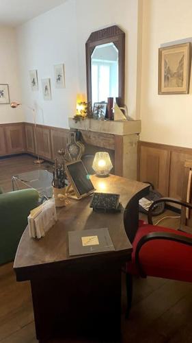 an office with a desk with a computer on it at Maison de charme Bord de Loire -15mn des plages in Saint-Paimboeuf