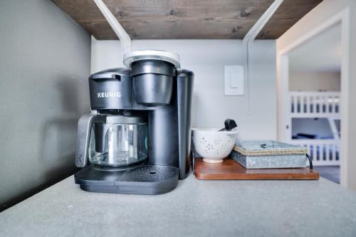 a coffee maker sitting on top of a counter at 3 BR 2 BA Modern home with private hot tub, fire pit and lake view, Dogs ok! in Tobyhanna
