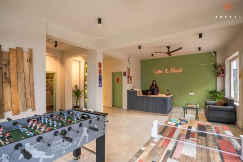 a room with a lego table in the middle at Zostel Dharamkot in McLeod Ganj