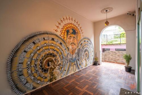 a mural on the wall of a room at Zostel Dharamkot in McLeod Ganj