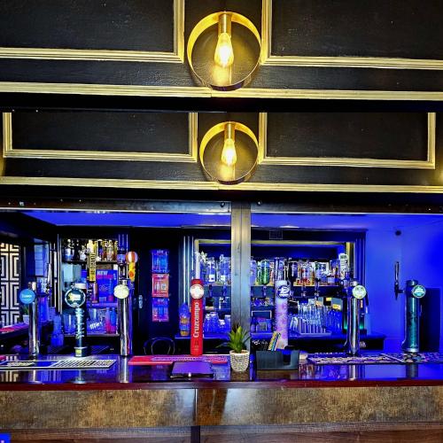 a bar with a lot of bottles of alcohol at Sapphire hotel blackpool promenade in Blackpool