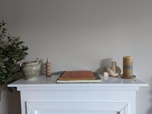 a white table with some items on top of it at Wohnung mit direktem Seeblick in Möhnesee