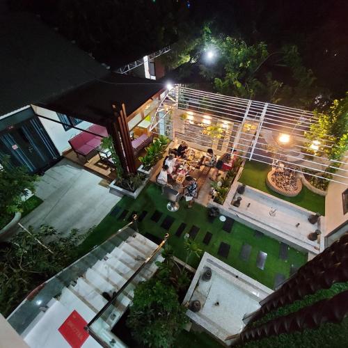 an overhead view of a house at night with a patio at QV Manor Homestay in Phan Rang