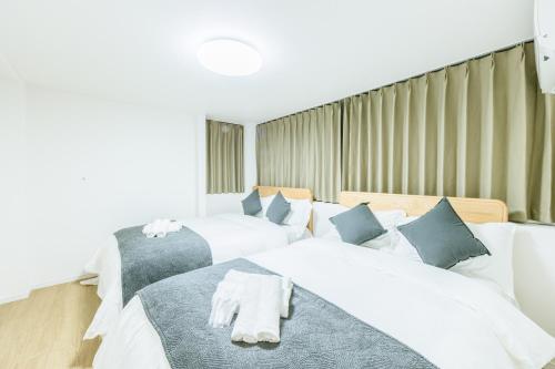 Giường trong phòng chung tại F2 Room懿 - 5 minutes from Ebisu cho -No elevator