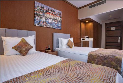 Postel nebo postele na pokoji v ubytování Ramada by Wyndham Istanbul Alibeykoy