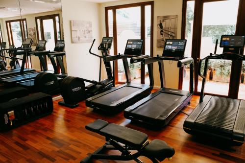 a gym with a bunch of tread machines in a room at Hotel Cipriani, A Belmond Hotel, Venice in Venice