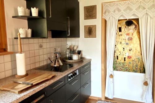 a kitchen with a sink and a counter top at Platz zum Wohlfühlen „cook&chill“ in Ermatingen