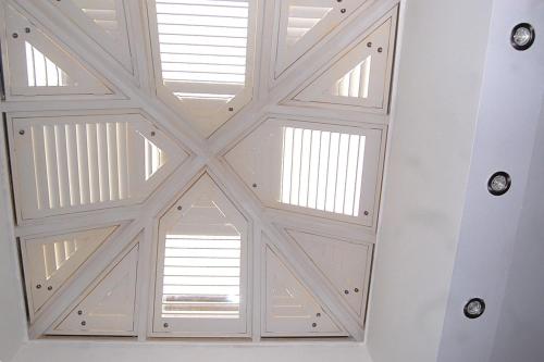 a room with a white ceiling with windows at 65A Beauchamp in Leamington Spa