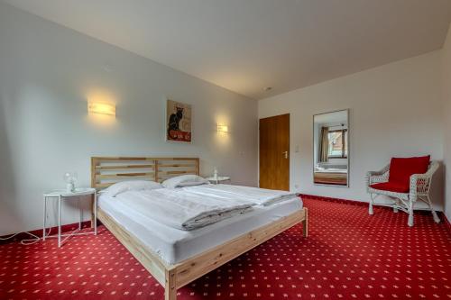 Postel nebo postele na pokoji v ubytování Hahnenkamm Residenz