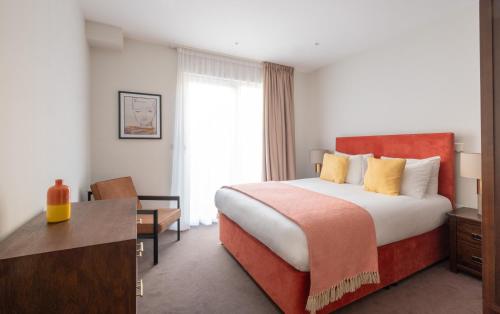 a hotel room with a bed and a desk at Native Victoria in London
