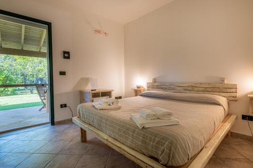 Postel nebo postele na pokoji v ubytování Bio Agriturismo Salos