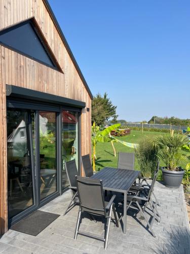 a patio with a table and chairs on a patio at BananaHouse in Kruszwin